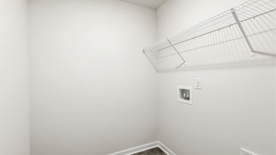 Laundry room with hanging racks.