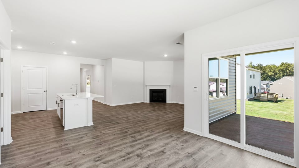 Living room with view of kitchen.