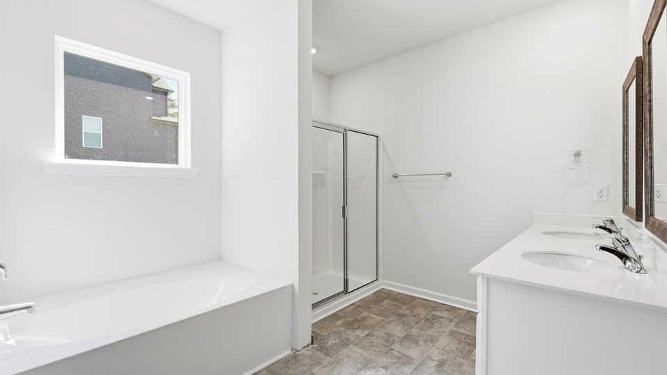 Bathroom with window and batttub.