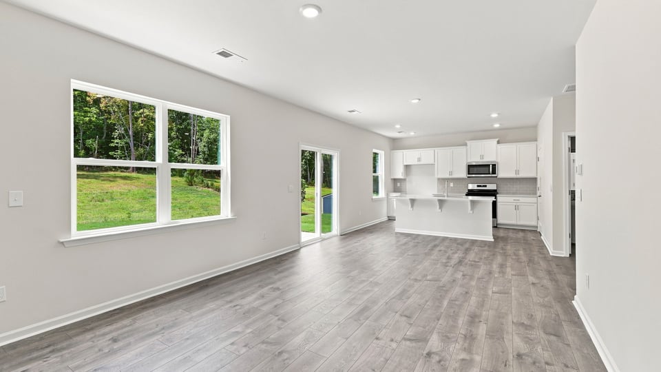 Living room with windows and fireplace.