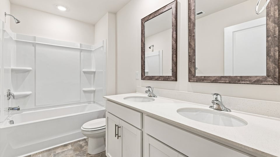 Bathroom with doble vanity sink and bathub.