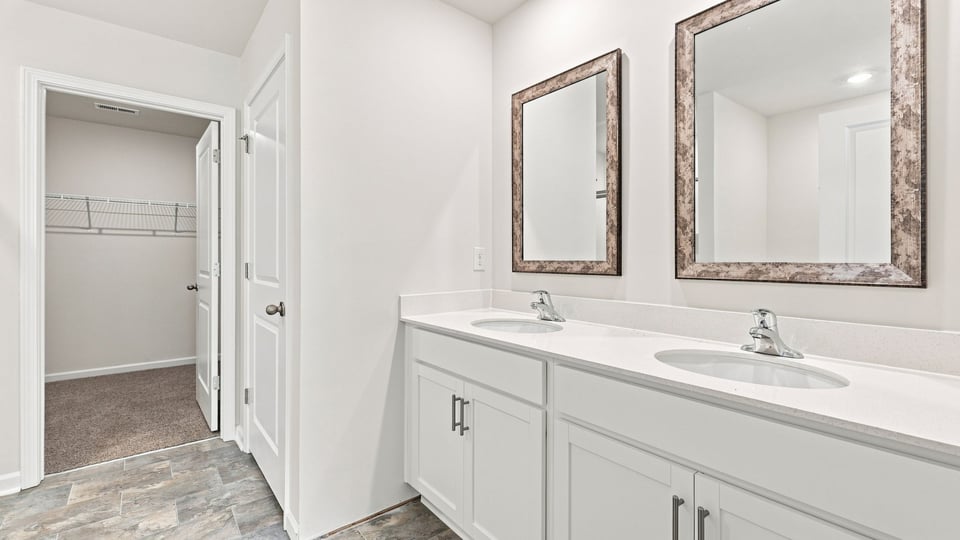 Primary bathroom with double vanity sinks.