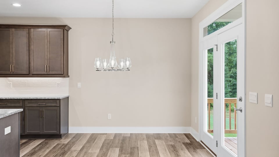 Kitchen and island with stainless steel appliances.