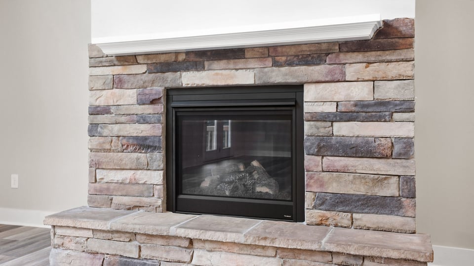 Living room with windows and fireplace.