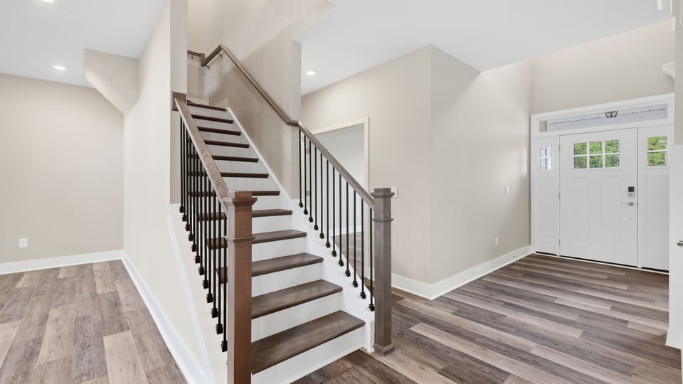Stairs with carpet to bedroom.