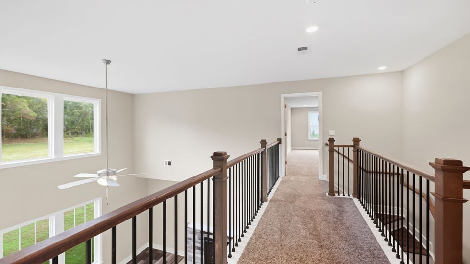 Loft area with carpet.