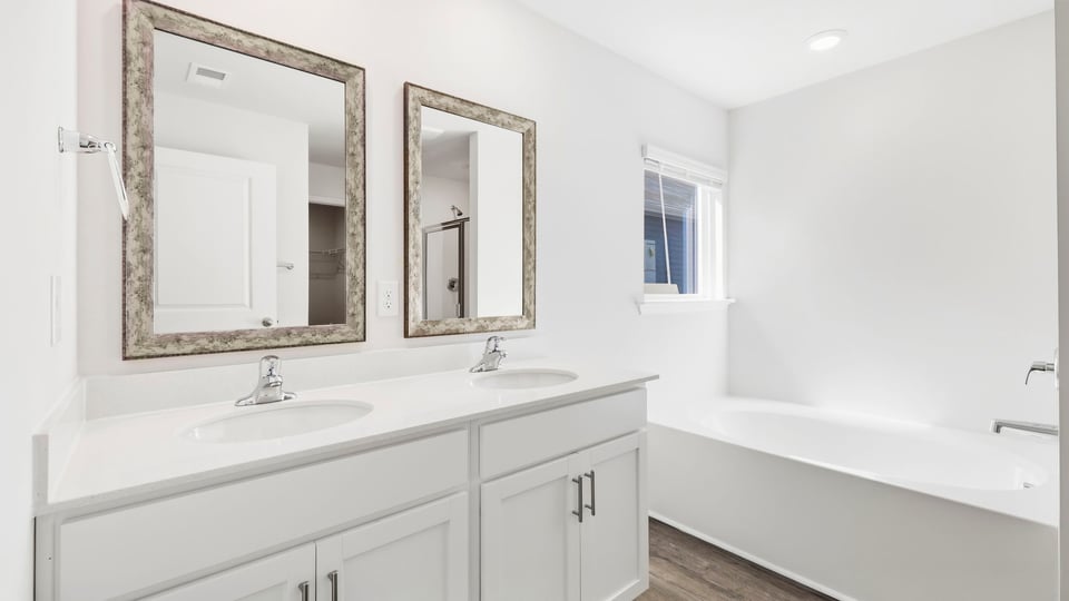 Bathroom with window and batttub.