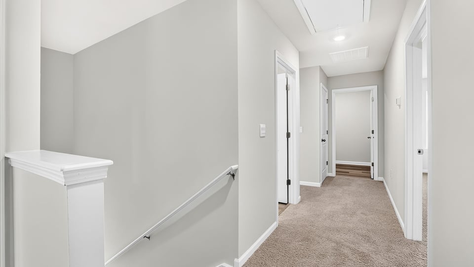 Loft area with carpet.