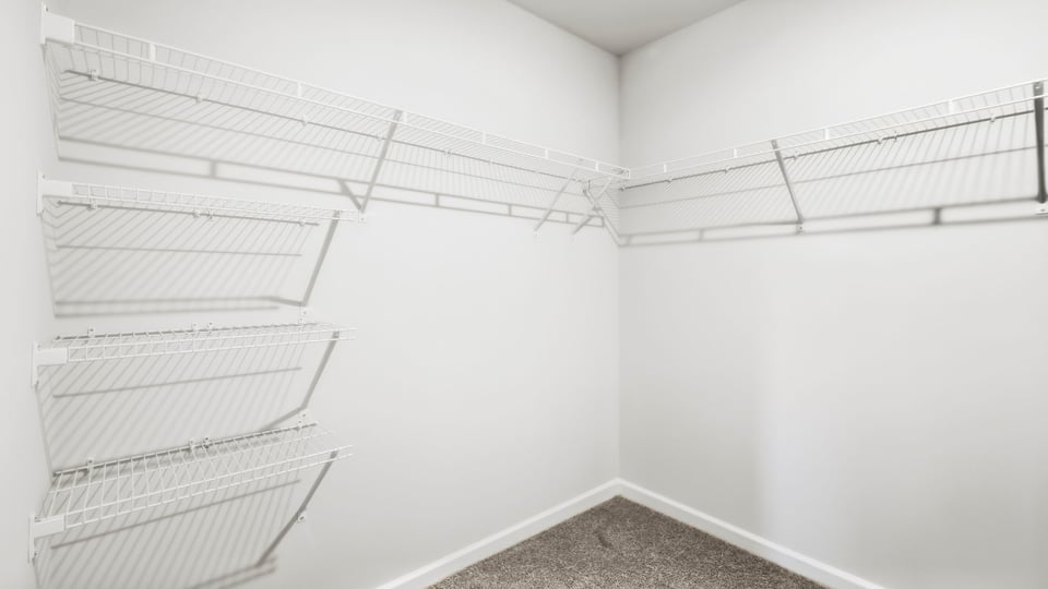 Closet with hanging storage racks.