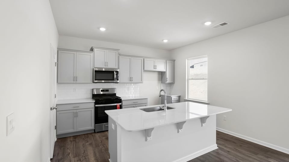 Kitchen with island and countertops.