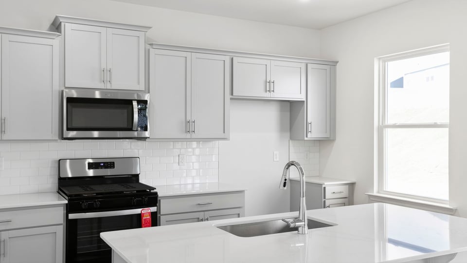 Kitchen with island and countertops.