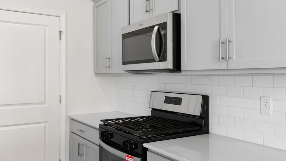 Kitchen with island and countertops.