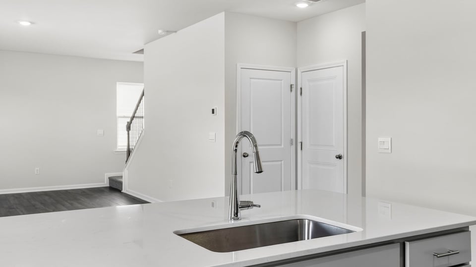 Kitchen with island and countertops.