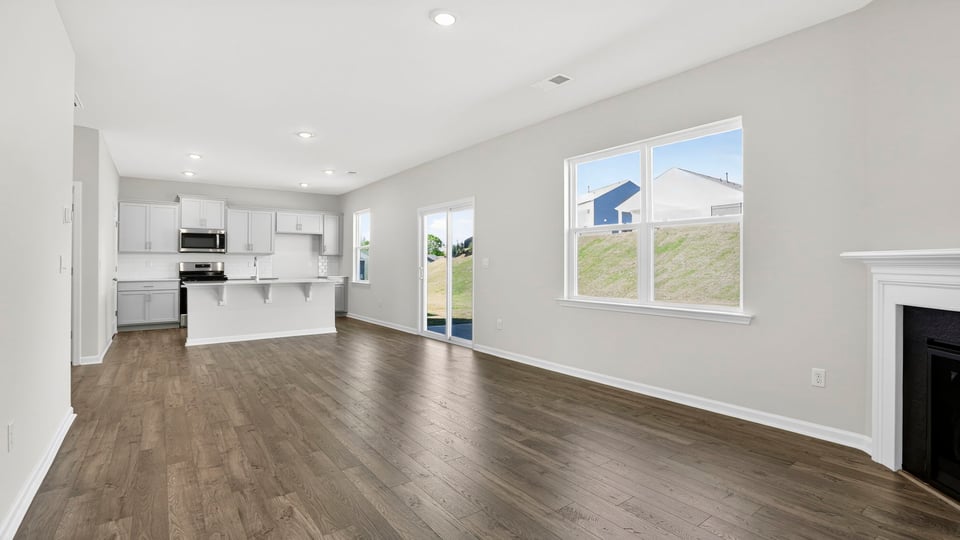 Livingroom with fireplace and windows.