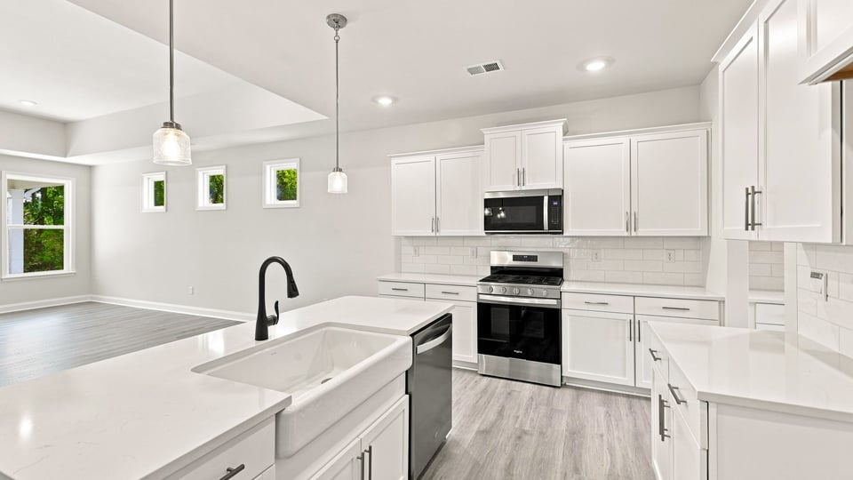 Kitchen with island and cabinets.