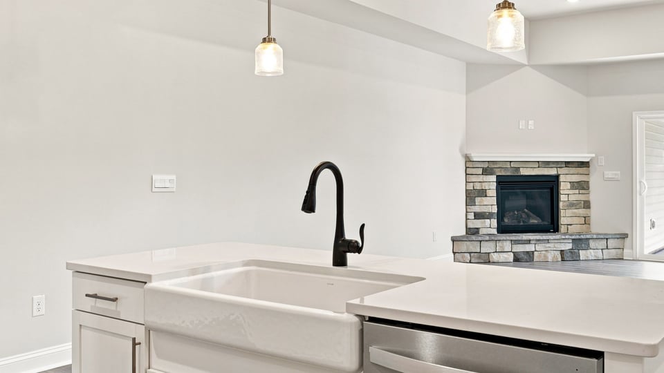 Kitchen with island and cabinets.