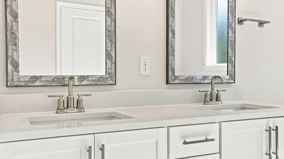 Primary bathroom with double vanity sinks.
