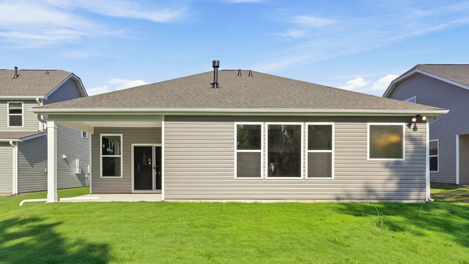 Back exterior with large backyard.