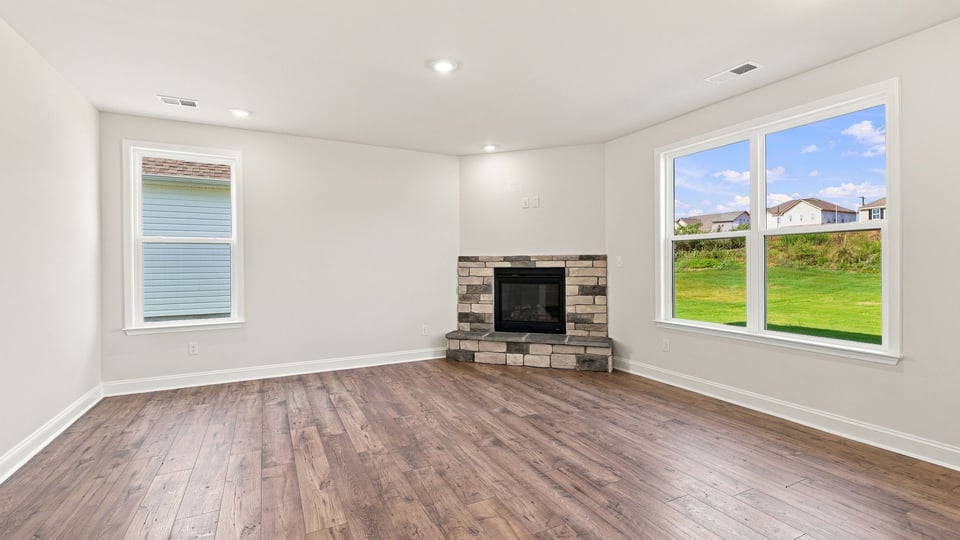 Living area with fireplace and window.
