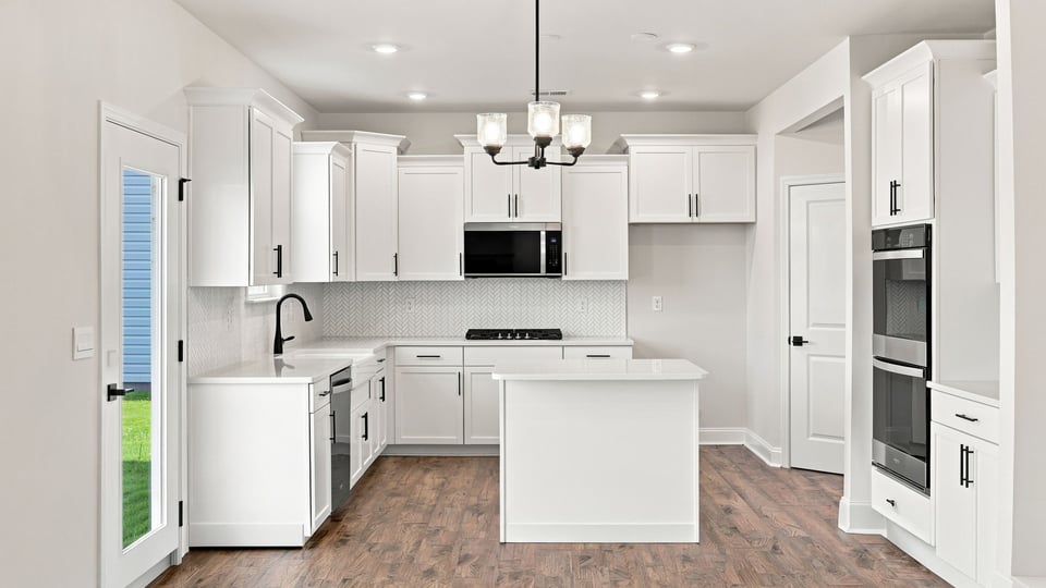 Kitchen with island and cabinets.