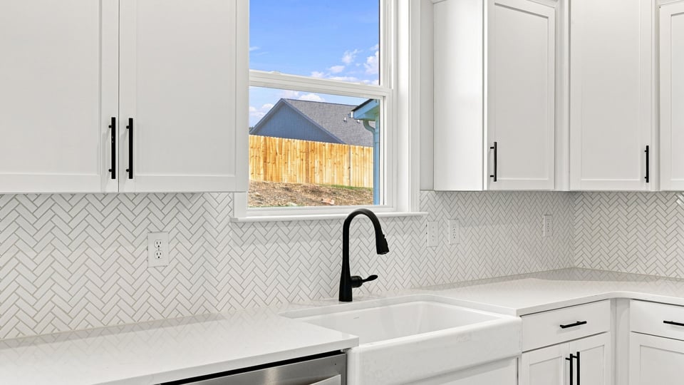 Kitchen with island and cabinets.