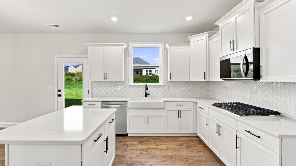 Kitchen with island and cabinets.