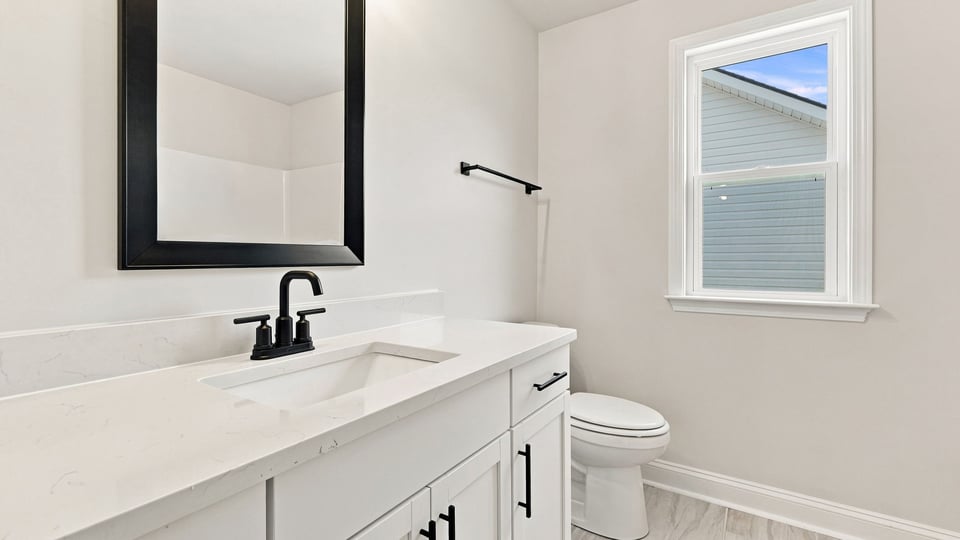 Bathroom with vanity sinks.