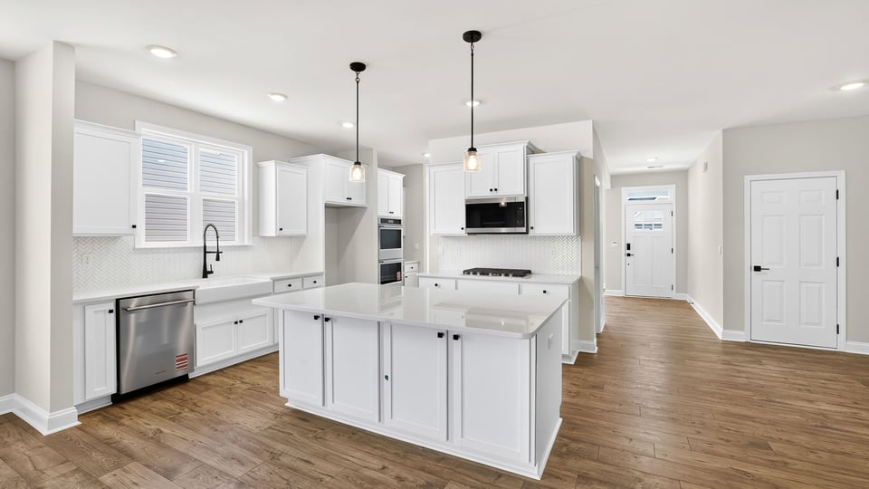 Kitchen with island and countertops.
