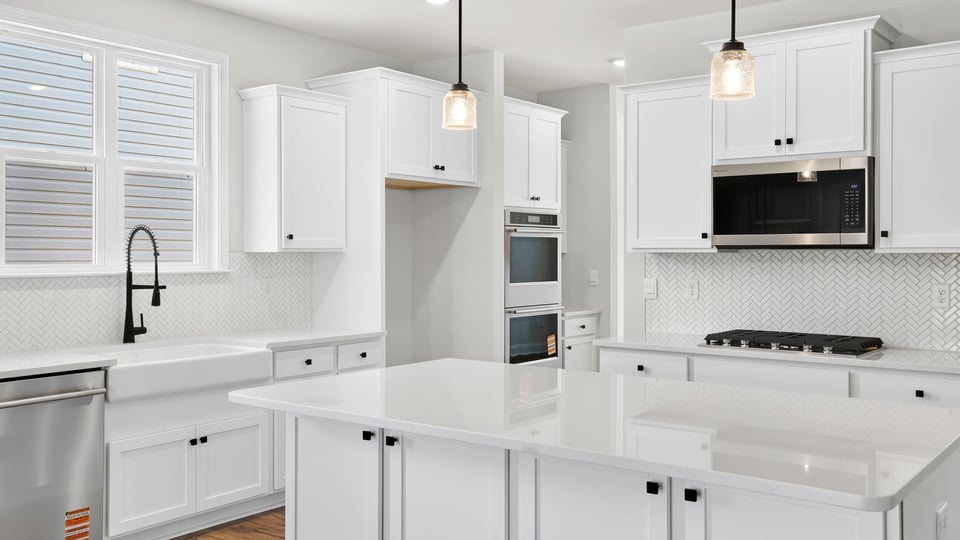Kitchen with island and countertops.