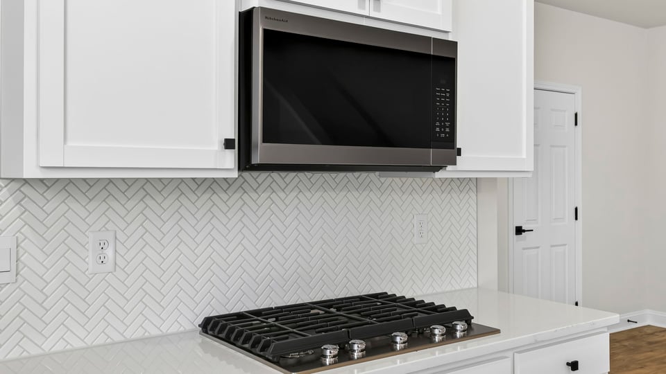 Kitchen with island and countertops.