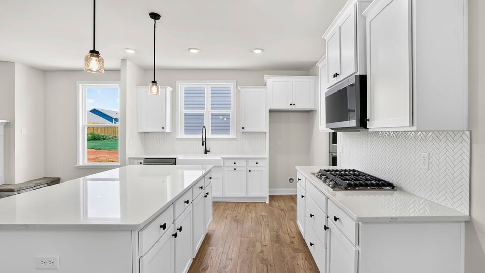 Kitchen with island and countertops.