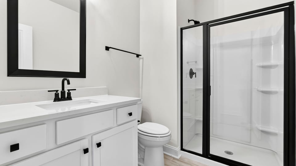 Bathroom with walk in shower.