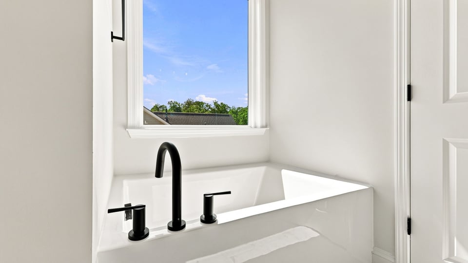 Bathroom with bathtub.