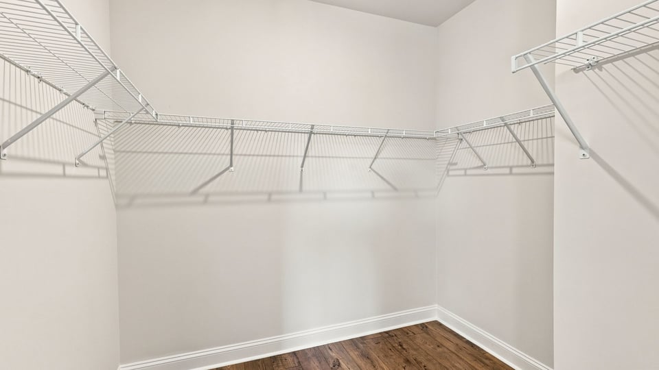 Closet with hanging storage racks.