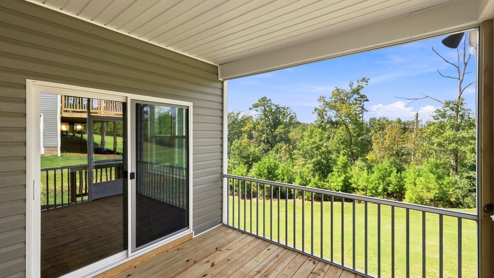 Back exterior of home with covered porch.