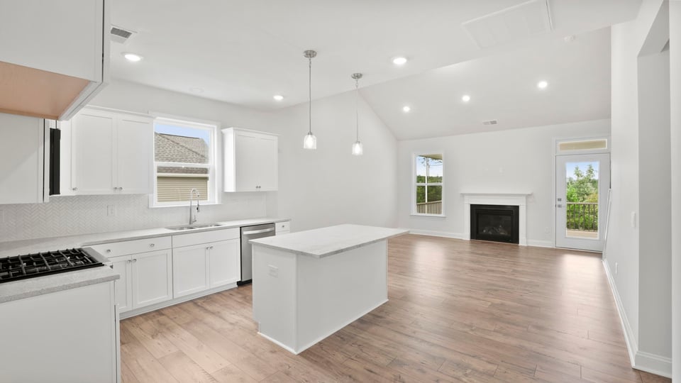 Kitchen with island and cabinets.