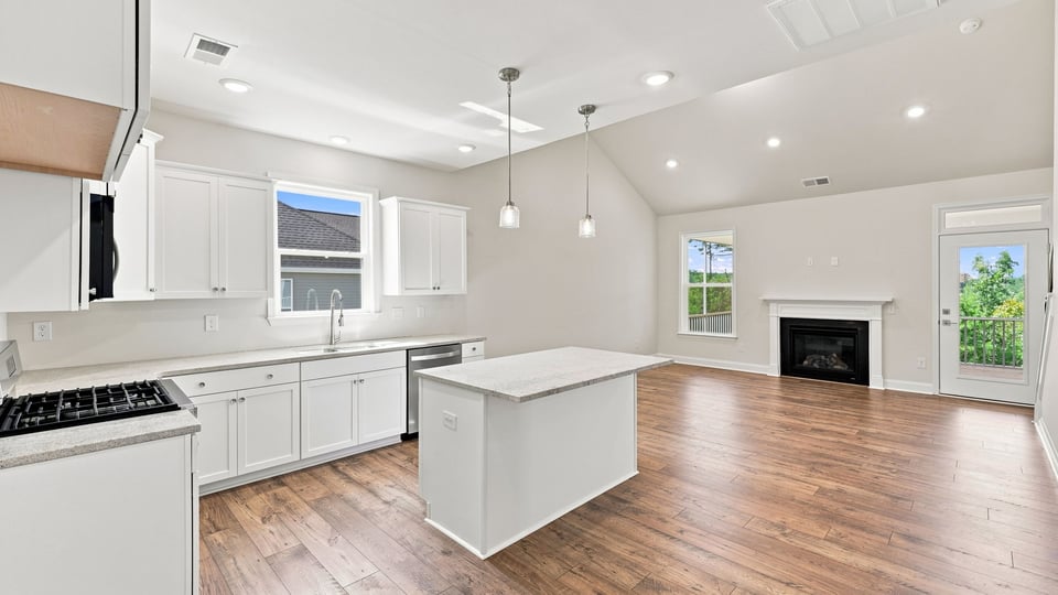 Kitchen and island with quartz countertops.