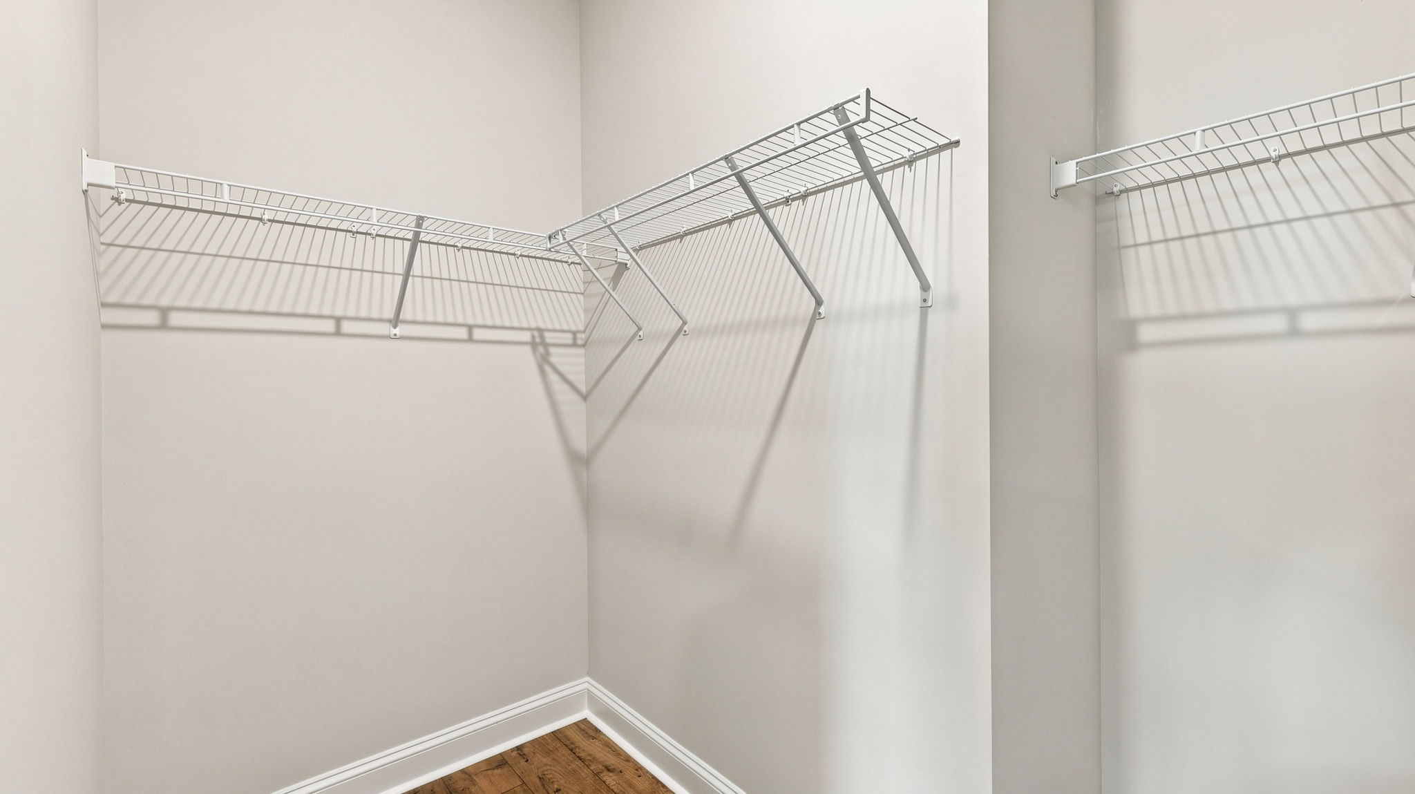 Primary closet with shelf.