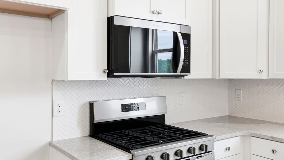 Kitchen with island and cabinets.
