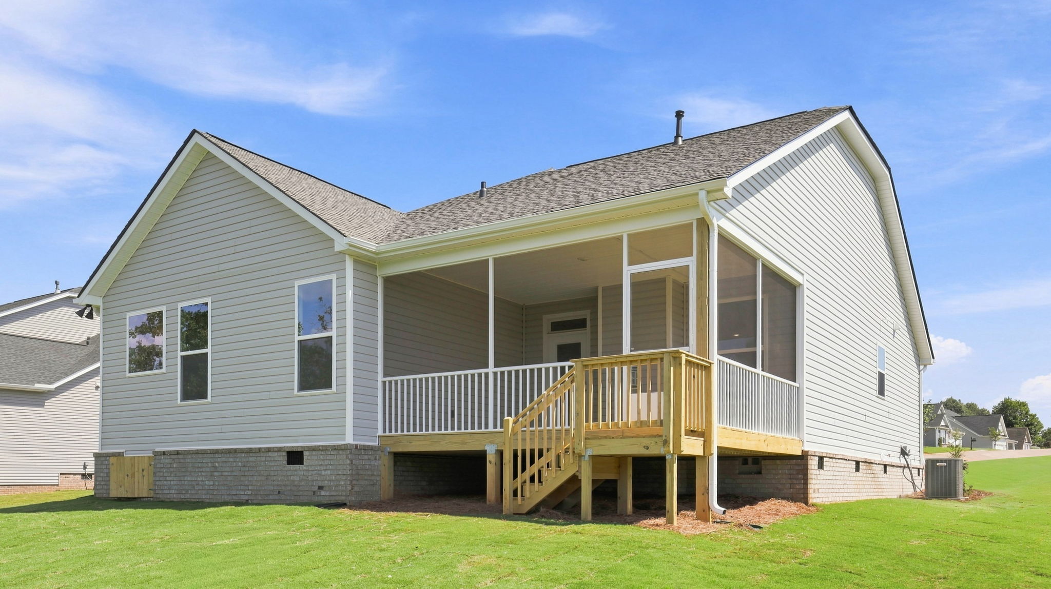 Back exterior with large backyard.