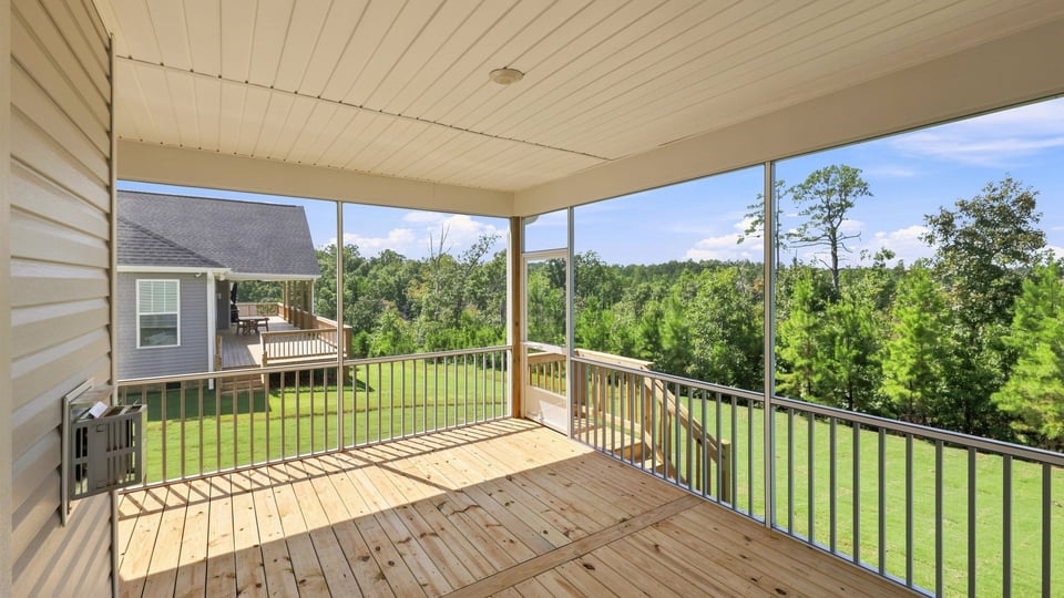 Back exterior of home with covered patio.