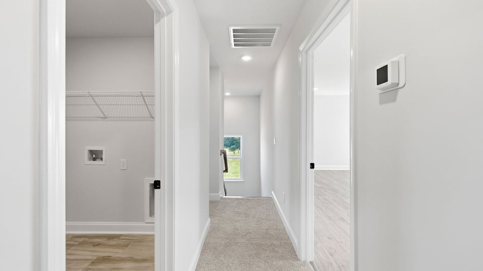 Hallway with carpet.