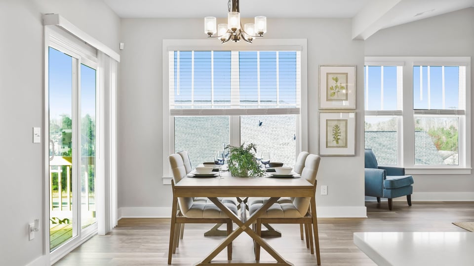 Living area with fireplace and windows.