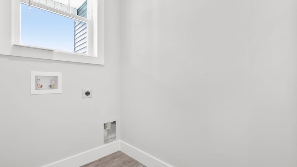 Laundry room with window.