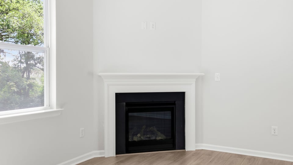Livingroom with window and fireplace.
