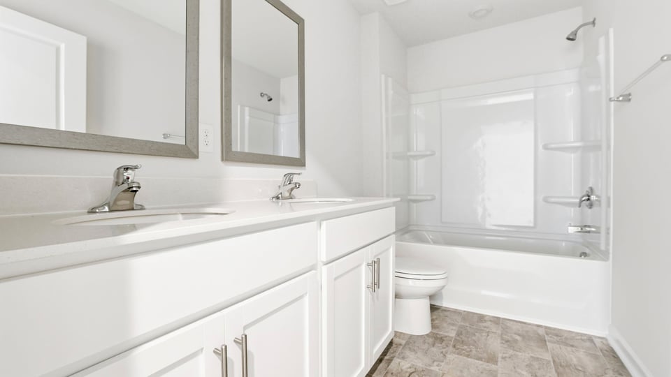 Bedroom with vanity and Tub.