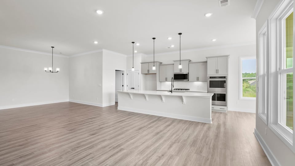 Kitchen area with quartz countertops.