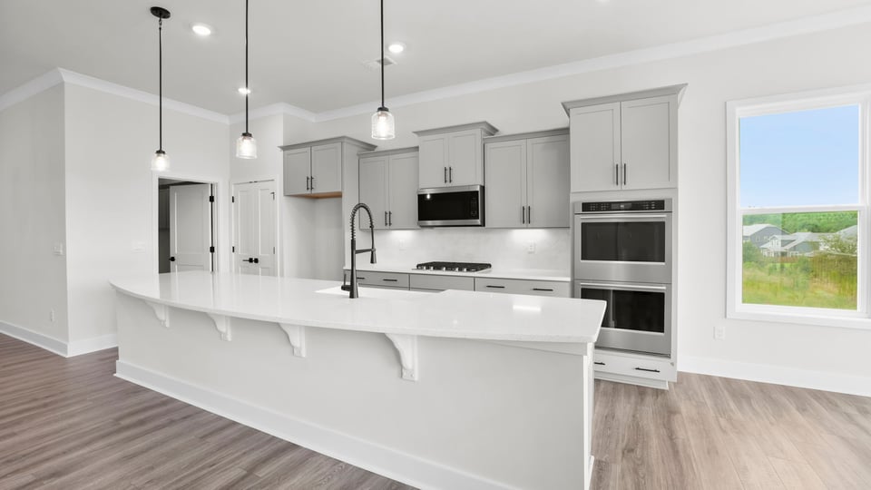 Kitchen area with quartz countertops.