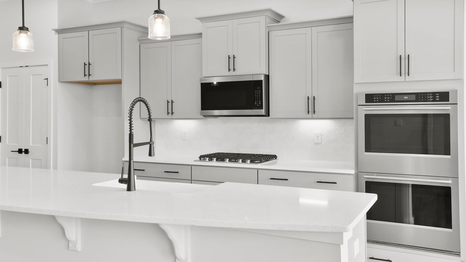 Kitchen area with quartz countertops.