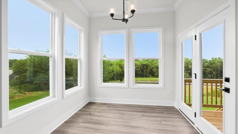 Sunroom with big windows.